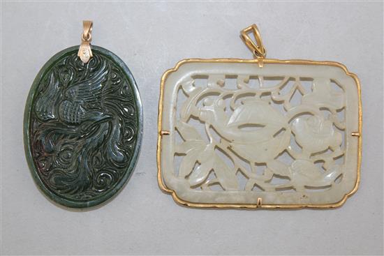 Two Chinese jade plaques, 5.3cm., the mount marked 18K